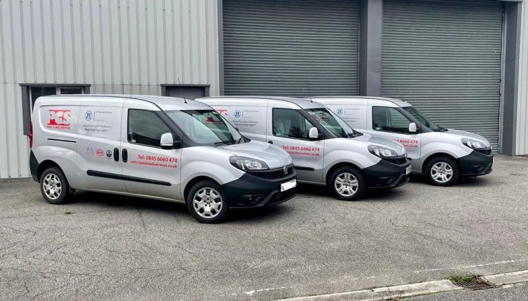 Fleet of Paul Clark Services vans