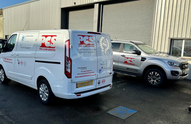 Paul Clark Services livery van next to PCS livery car.