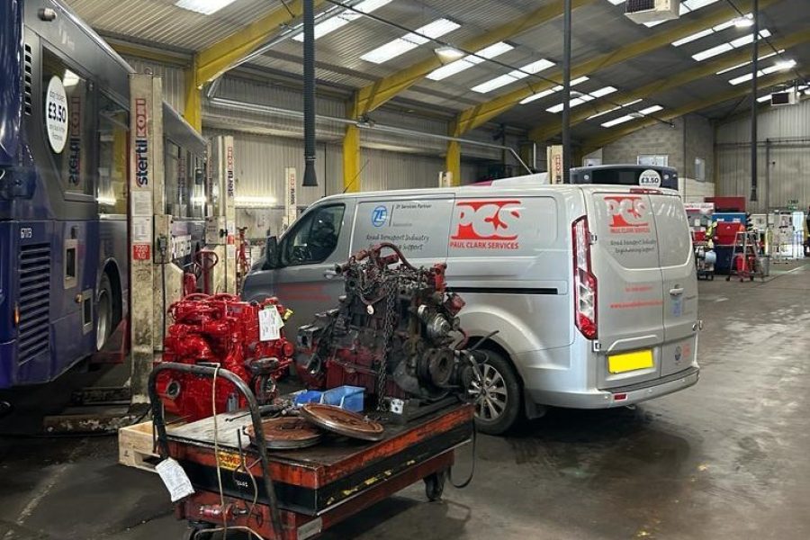 PCS van inside facility with engine removed from a vehicle.