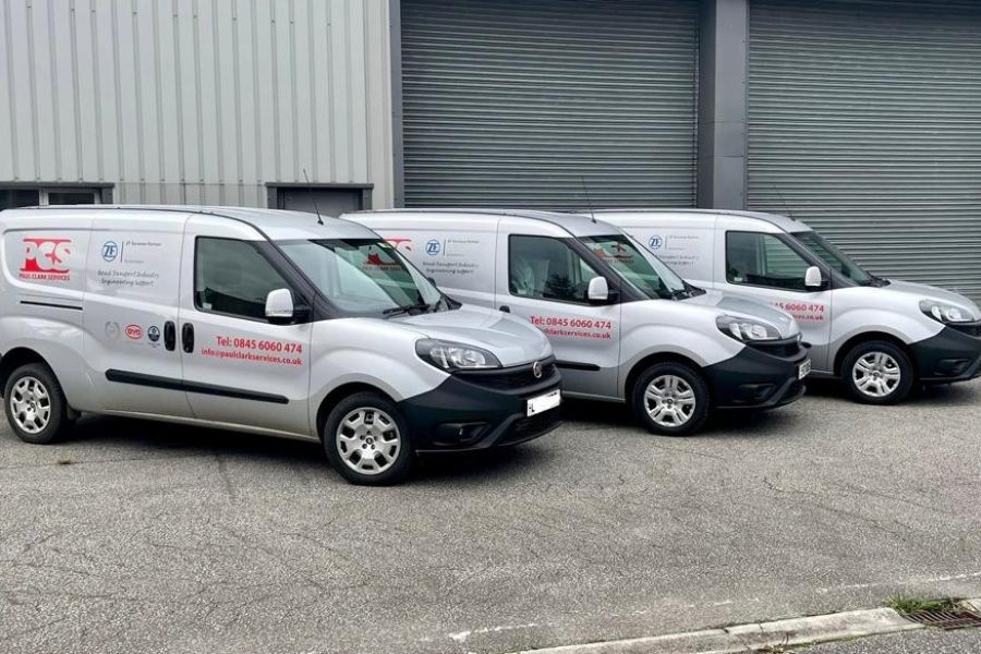 Fleet of Paul Clark Services vans